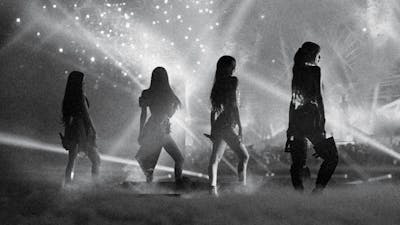 A black and white shot of the K-pop group BLACKPINK.